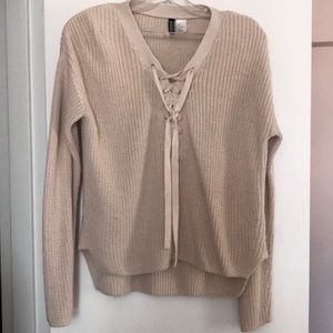 White knit sweater with criss cross detail